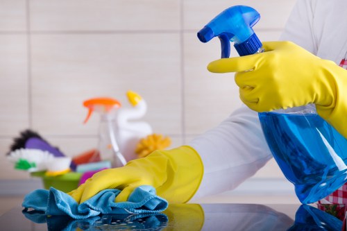 Professional carpet cleaner using extraction equipment carefully