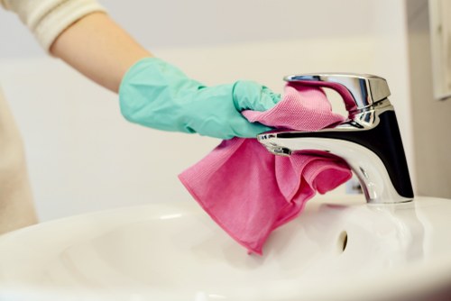 Technician checking cleaning products and safety controls